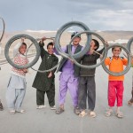 Bamiyan2 BAMYAN PROVINCE, Afghanistan - Local boys display the bicycle tires they race with on a street near Forward Operating Base Bamyan June 24, 2012. (U.S. Army photo by Sgt. Ken Scar, 7th Mobile Public Affairs Detachment) - published in Bamyan Province emerges as a model for Afghanistan’s potential by rceast